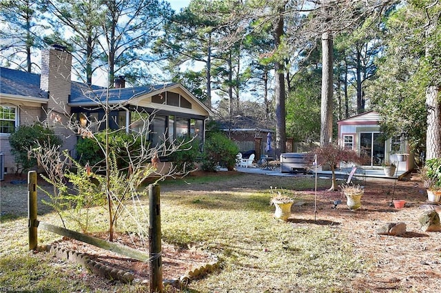 view of yard featuring a sunroom