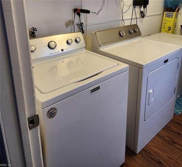 washroom with washer and dryer and dark hardwood / wood-style flooring