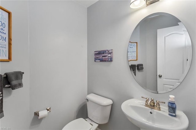 bathroom with toilet and sink