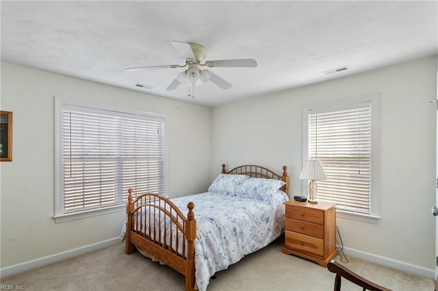 bedroom featuring ceiling fan and light colored carpet