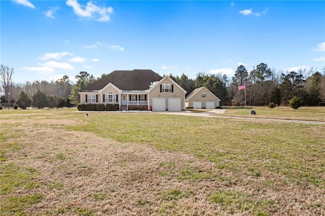 view of front of property with a garage and a front yard