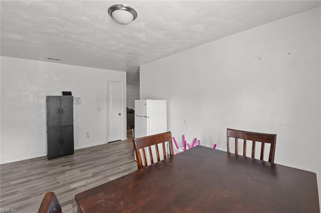 dining area with wood-type flooring