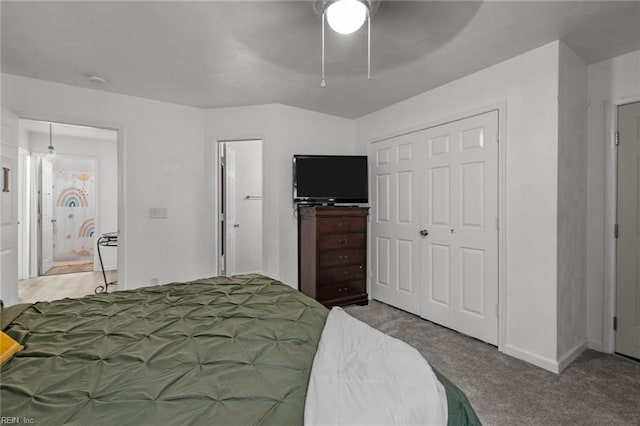 bedroom with connected bathroom, ceiling fan, a closet, and carpet floors