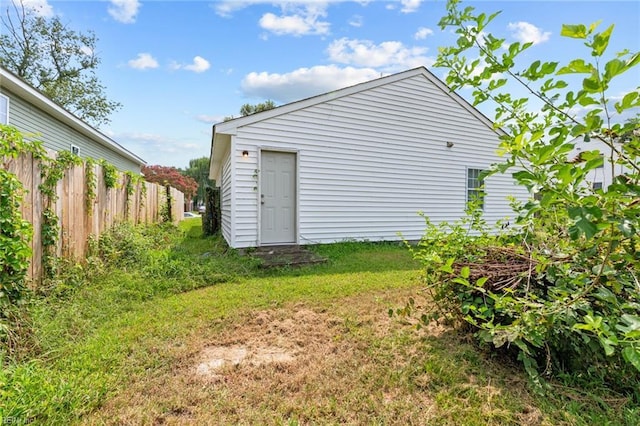 view of outdoor structure featuring a lawn