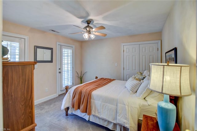 carpeted bedroom featuring ceiling fan, a closet, and access to exterior