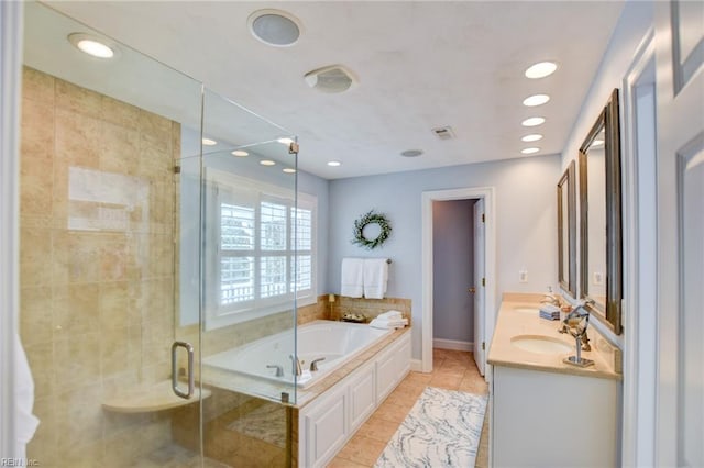 bathroom with tile patterned flooring, shower with separate bathtub, and vanity