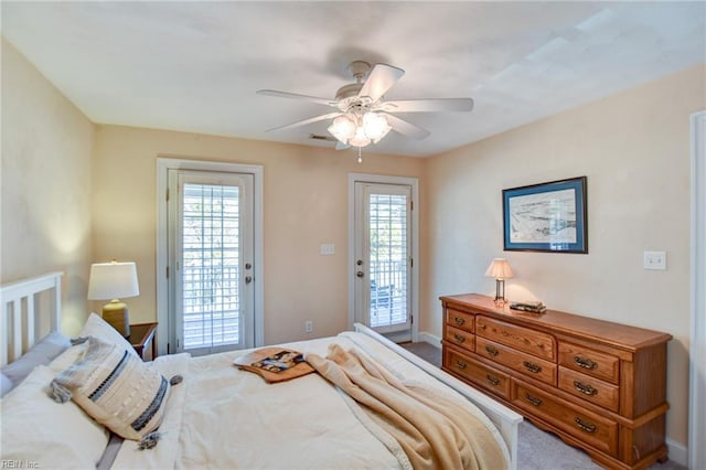 bedroom featuring access to outside, ceiling fan, and carpet