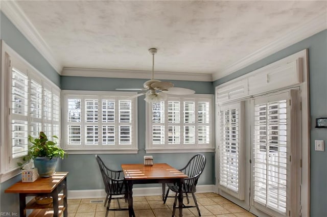 sunroom featuring ceiling fan