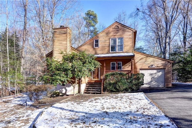 view of front of house with covered porch and a garage