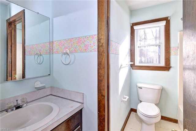 bathroom featuring toilet, vanity, and tile patterned floors