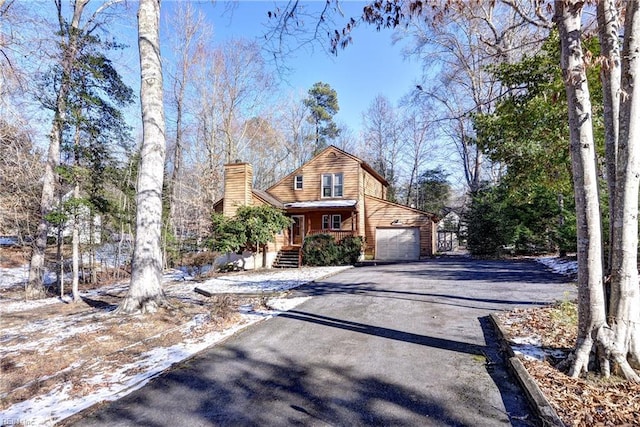 view of front facade with a porch and a garage