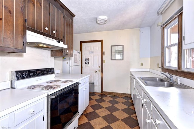 kitchen with white appliances, a textured ceiling, sink, and dark brown cabinetry