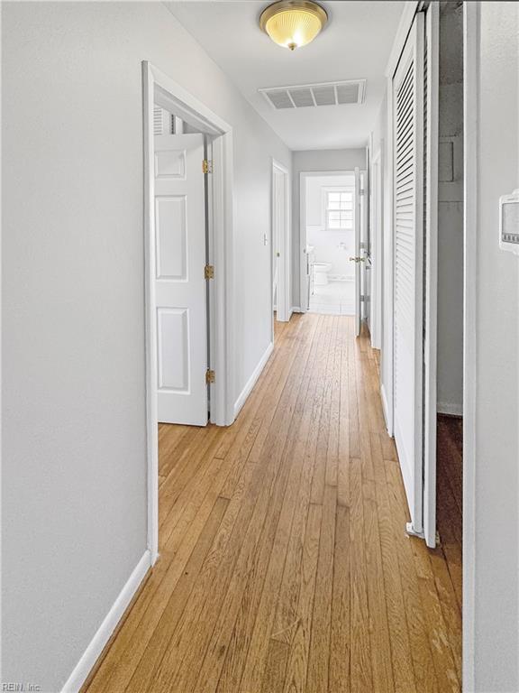 hall with light hardwood / wood-style flooring