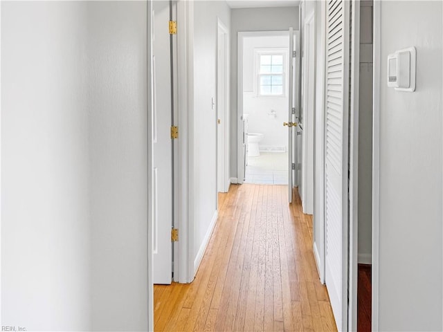 hall with light hardwood / wood-style flooring