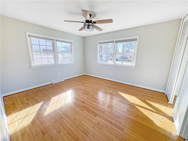 unfurnished bedroom with ceiling fan, a closet, and light hardwood / wood-style floors