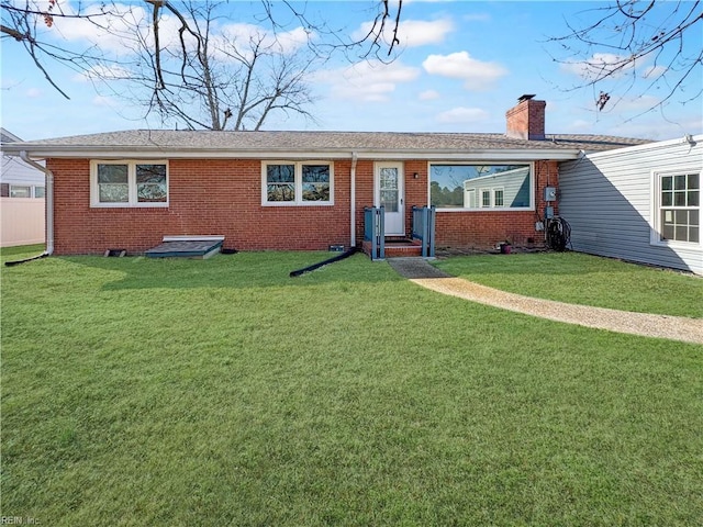 ranch-style house with a front lawn