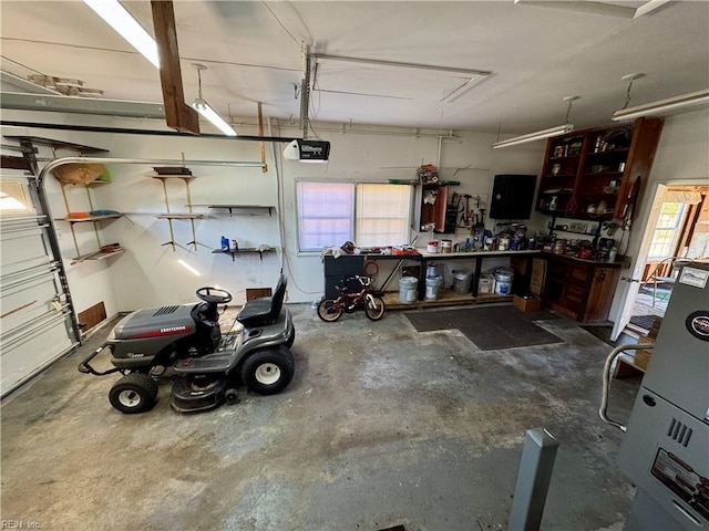 garage featuring a workshop area and a garage door opener