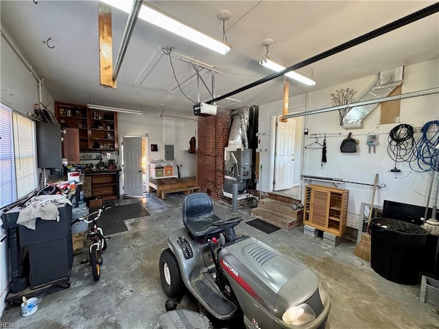 garage featuring a workshop area and a garage door opener