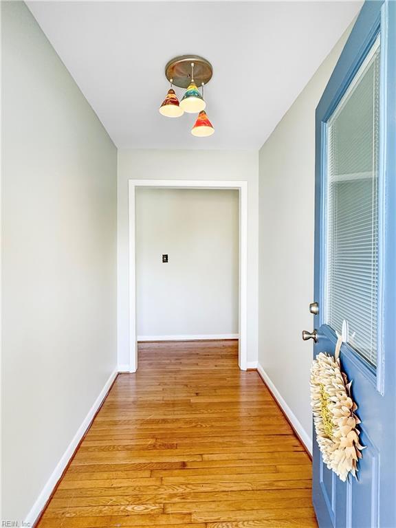 hall with light wood-type flooring