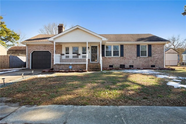 ranch-style house with covered porch, a front lawn, and a garage