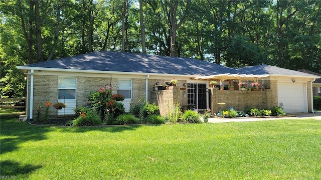 ranch-style house featuring a front yard and a garage