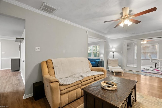 living room featuring ceiling fan, french doors, light wood-type flooring, and crown molding