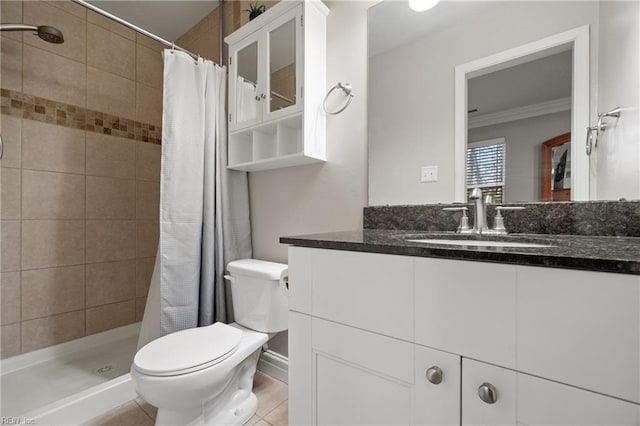 bathroom with ornamental molding, a shower with shower curtain, vanity, and toilet