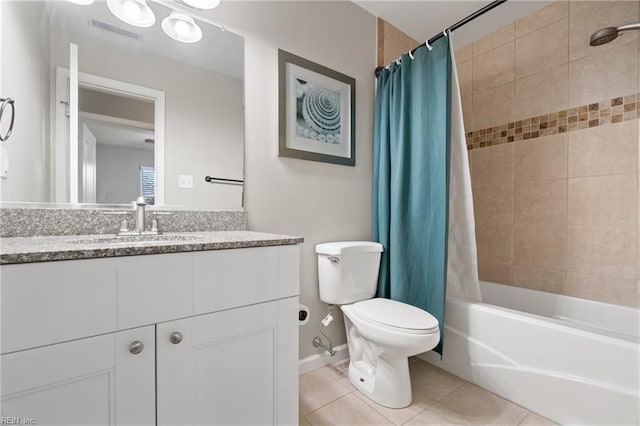 full bathroom featuring tile patterned flooring, shower / tub combo with curtain, vanity, and toilet