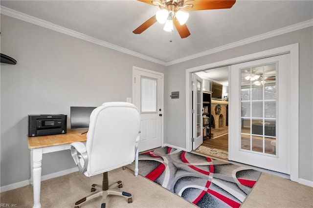 carpeted home office with french doors, ornamental molding, and ceiling fan