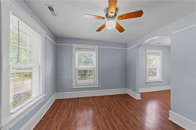 unfurnished room featuring ceiling fan and hardwood / wood-style floors