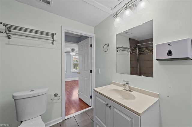 bathroom featuring toilet, vanity, and tile patterned floors