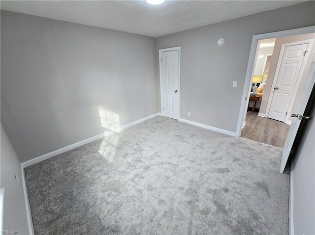 unfurnished bedroom with carpet