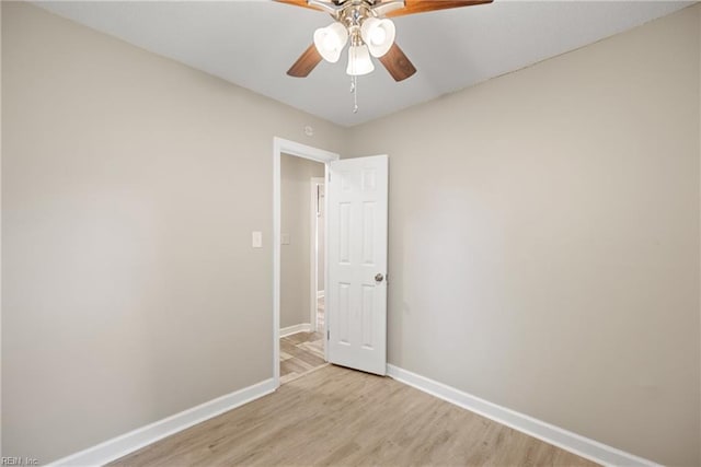 spare room with light hardwood / wood-style flooring and ceiling fan