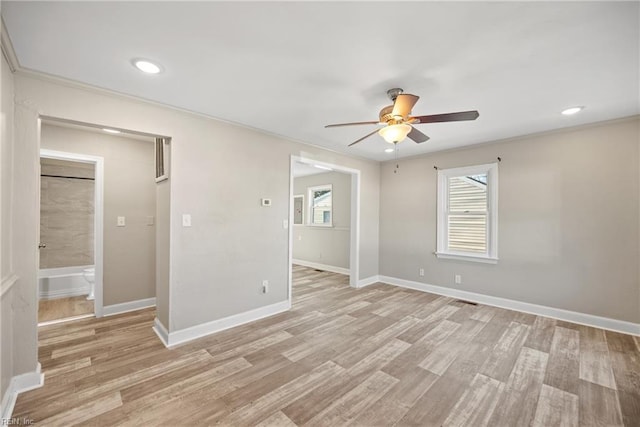 empty room featuring ceiling fan and light wood-type flooring