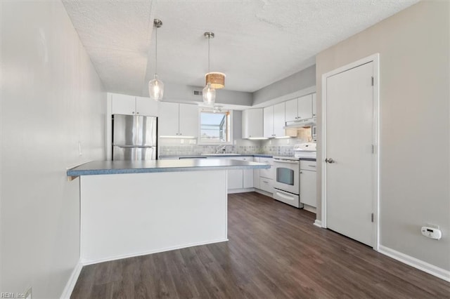 kitchen featuring electric range, white cabinets, decorative light fixtures, and stainless steel refrigerator