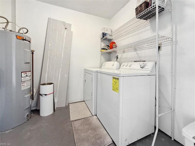 washroom featuring washer and dryer and electric water heater