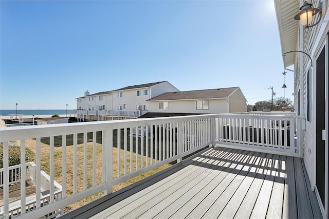 wooden deck featuring a water view