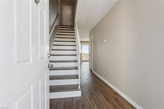 stairway featuring hardwood / wood-style flooring