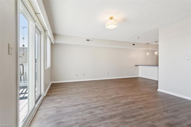 spare room with dark hardwood / wood-style floors