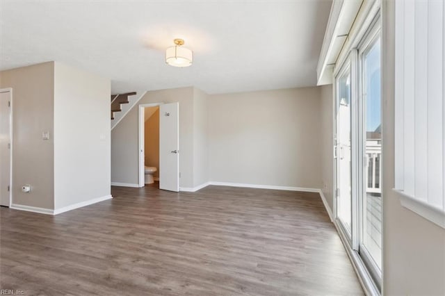 spare room featuring dark wood-type flooring