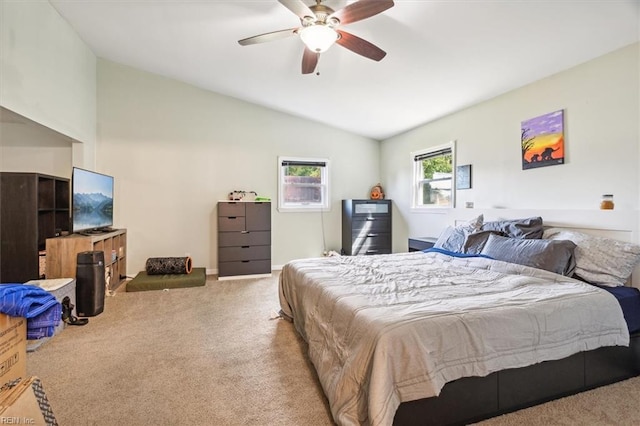 carpeted bedroom featuring vaulted ceiling and ceiling fan