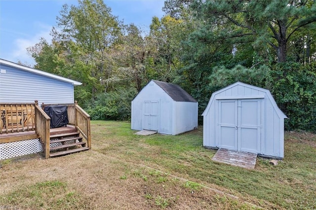 view of yard with a storage shed and a deck