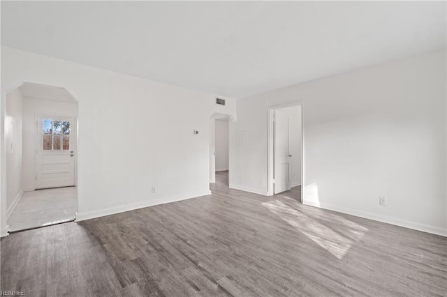 unfurnished room with hardwood / wood-style floors