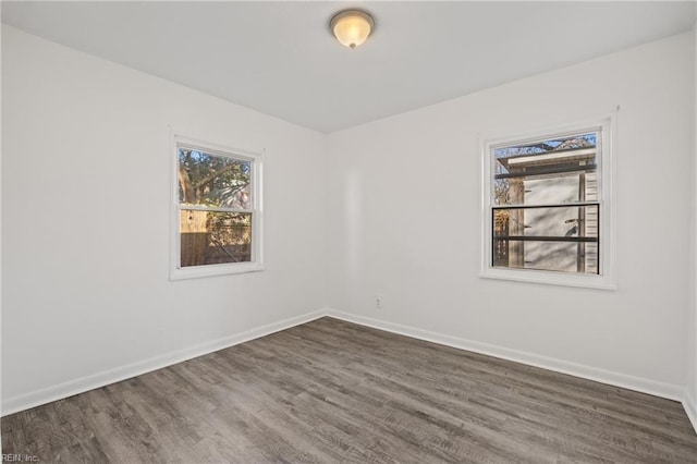 empty room featuring dark wood-type flooring