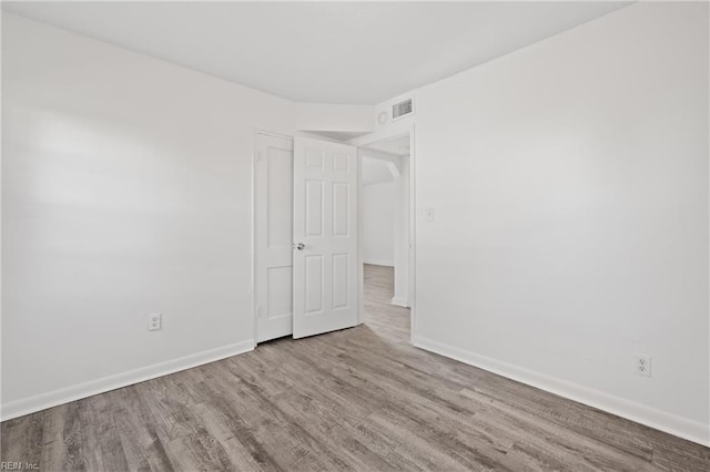 spare room with light wood-type flooring