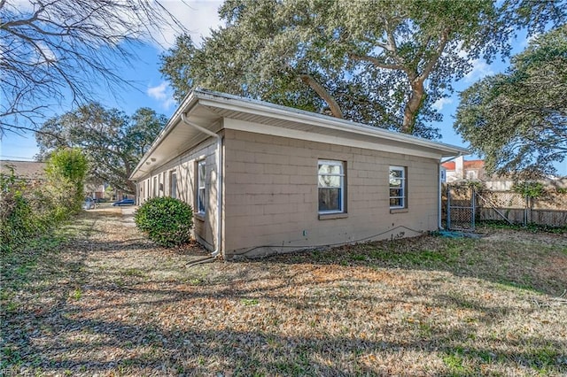 view of home's exterior with a yard