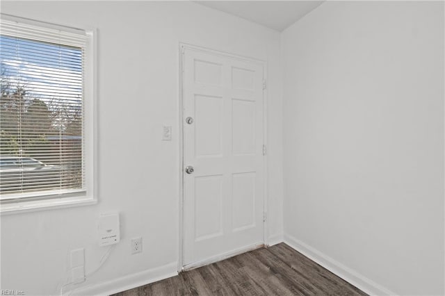 spare room with dark hardwood / wood-style floors