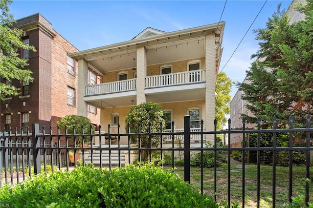 view of front of property with a balcony