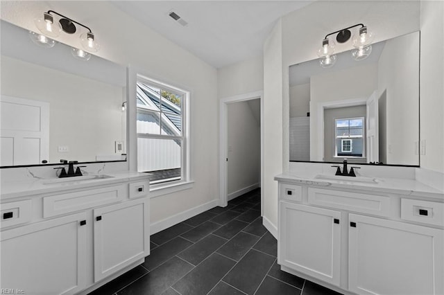 bathroom with vanity and tile patterned flooring