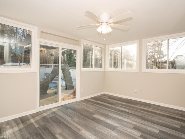 unfurnished sunroom with ceiling fan and a wealth of natural light